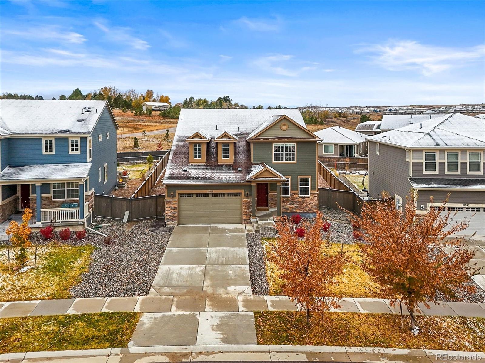 aerial view of a house with a yard