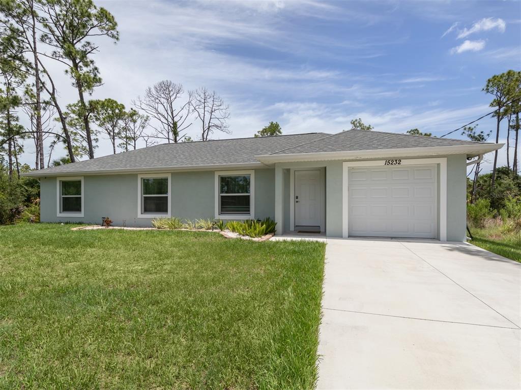 front view of a house with a yard