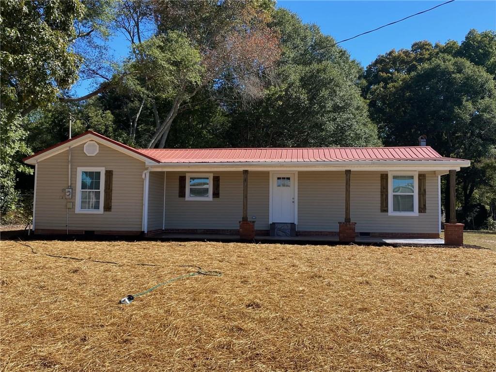 a view of house with yard