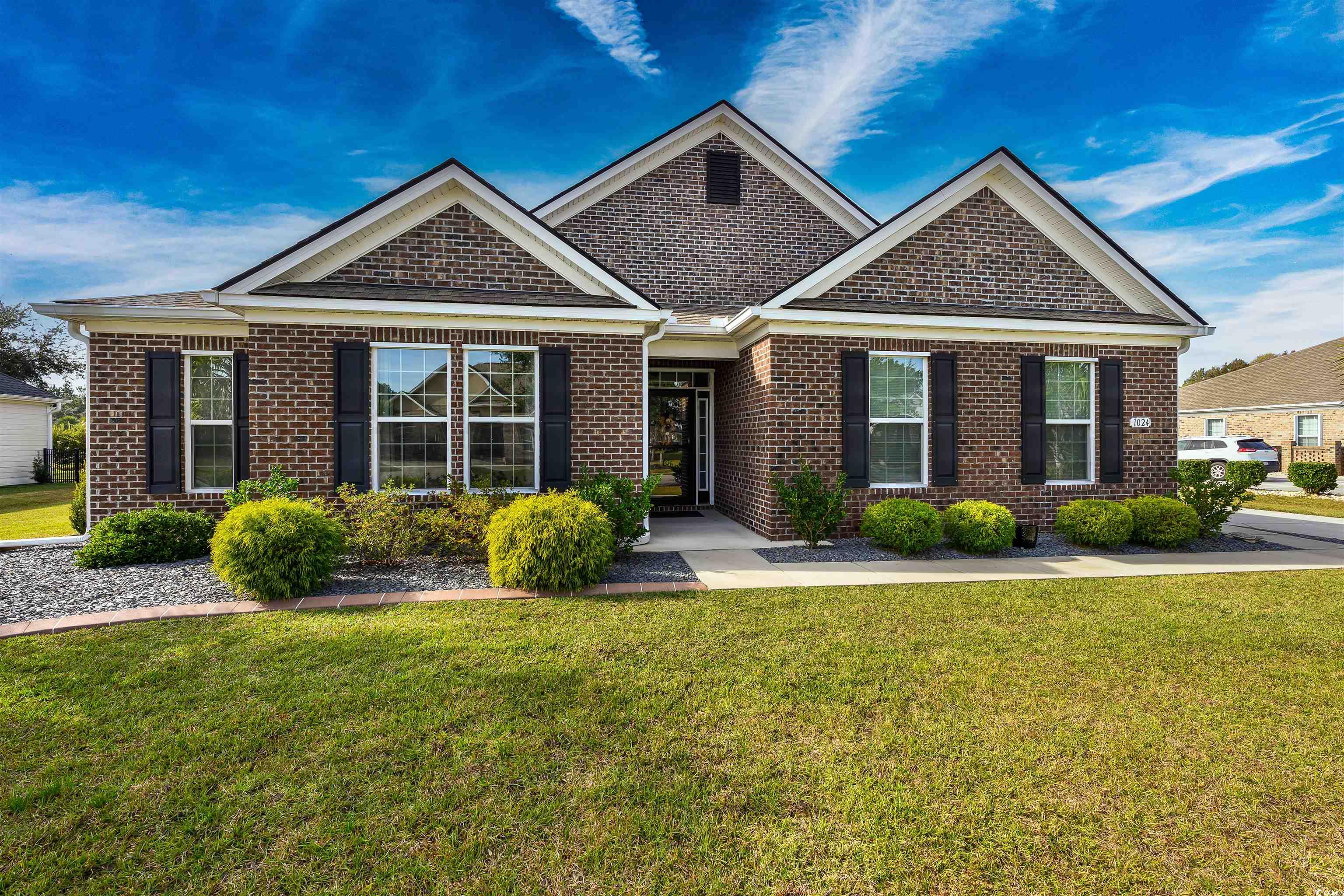 View of front of property with a front lawn