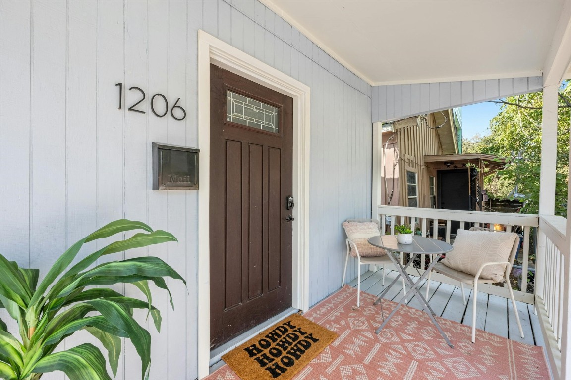 This charming home blends urban convenience with boho flair, offering a picturesque covered front porch for a peaceful retreat from the bustling streets.