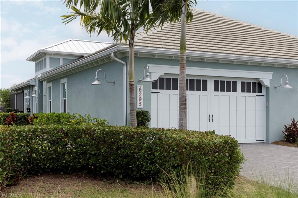 View of side of home with a garage