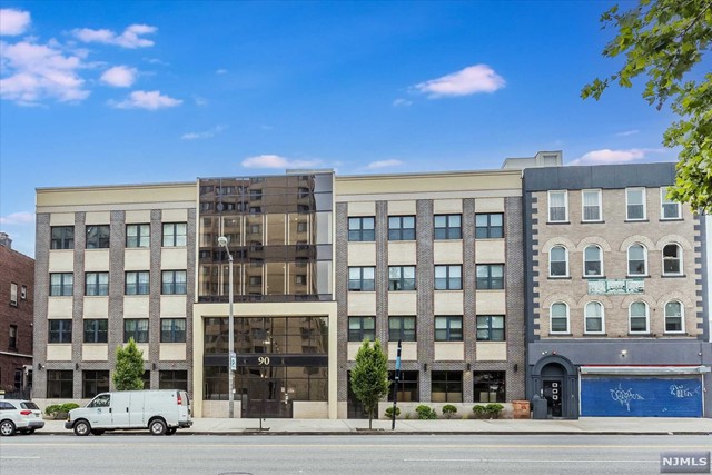 a front view of a building with street view