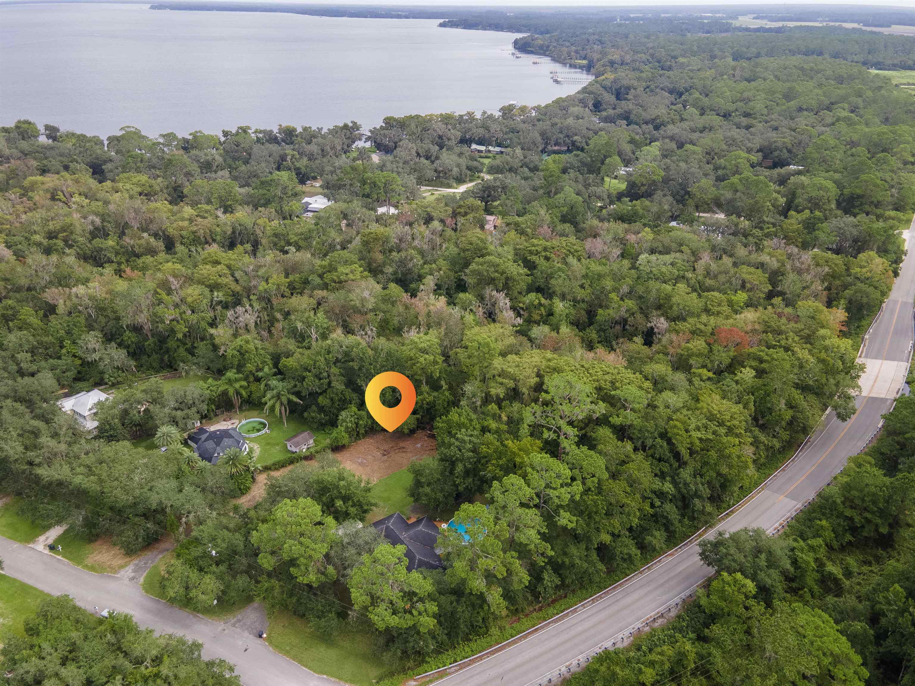 an aerial view of a trees and yard