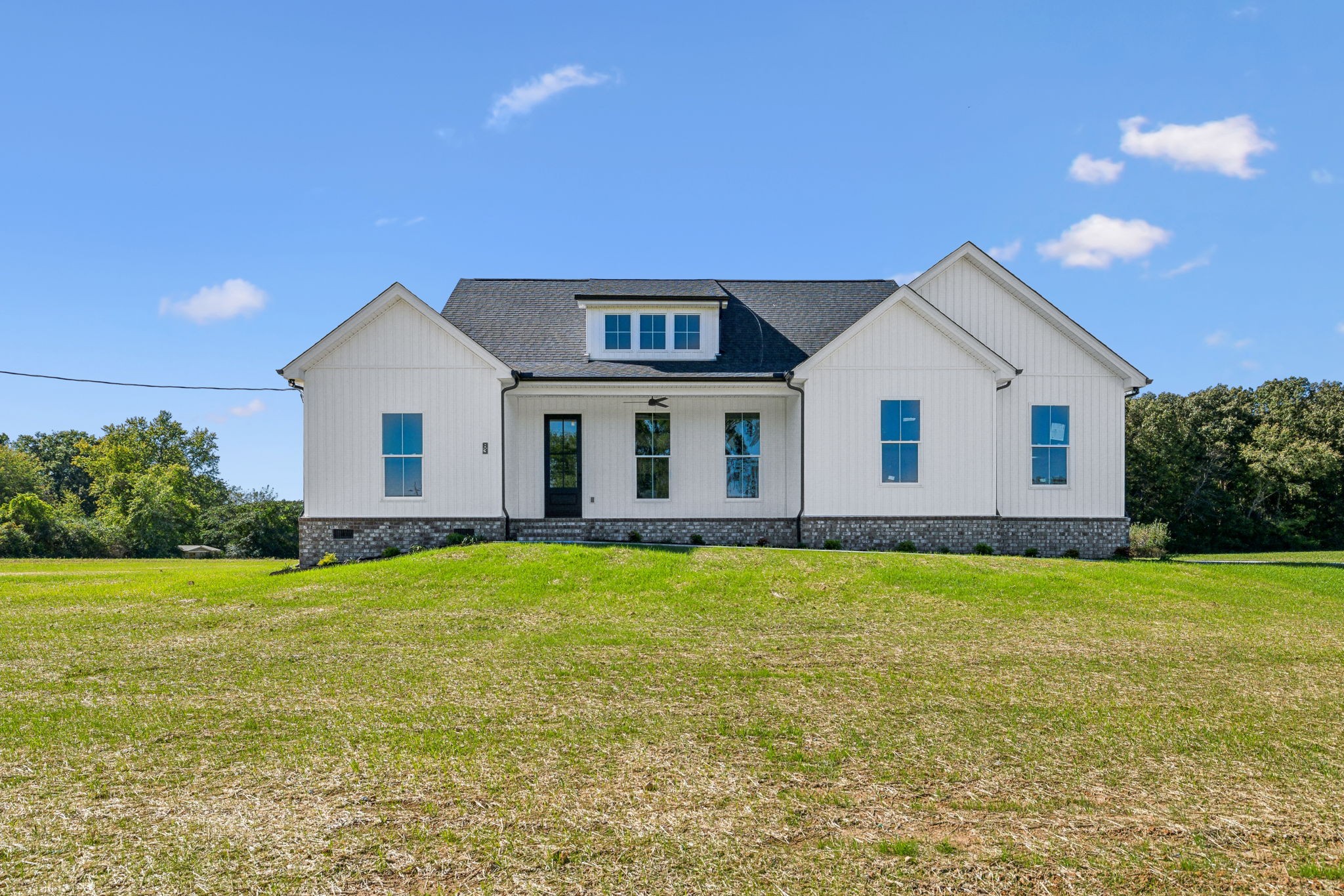 a view of a house with a yard and garage