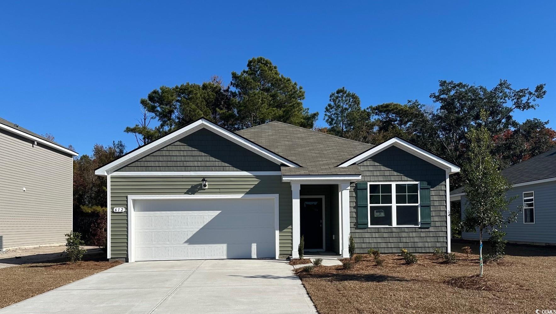 View of front of property with a garage