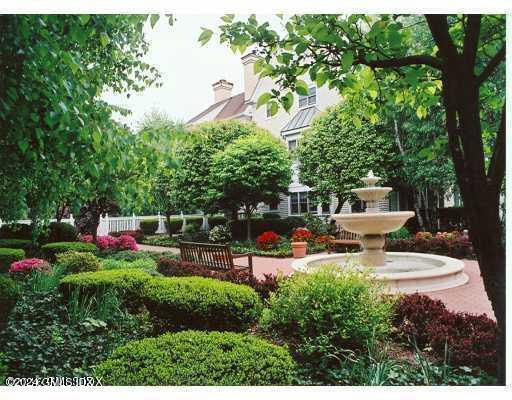 a view of a backyard with sitting area and slide