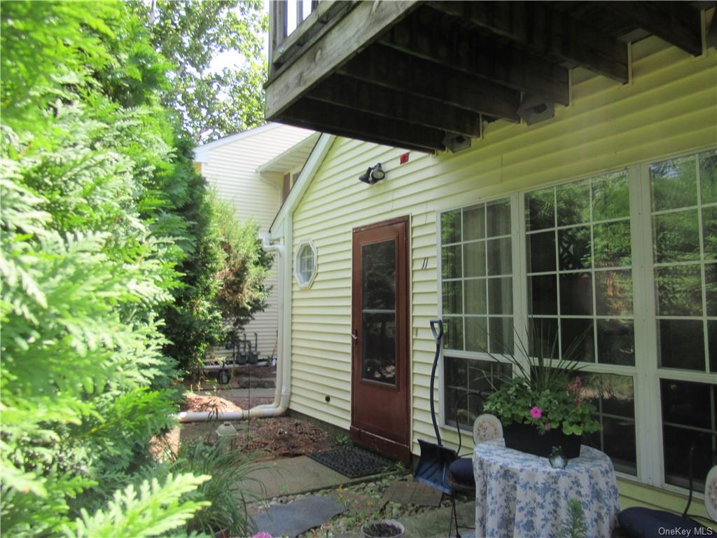 Entrance to property featuring a patio