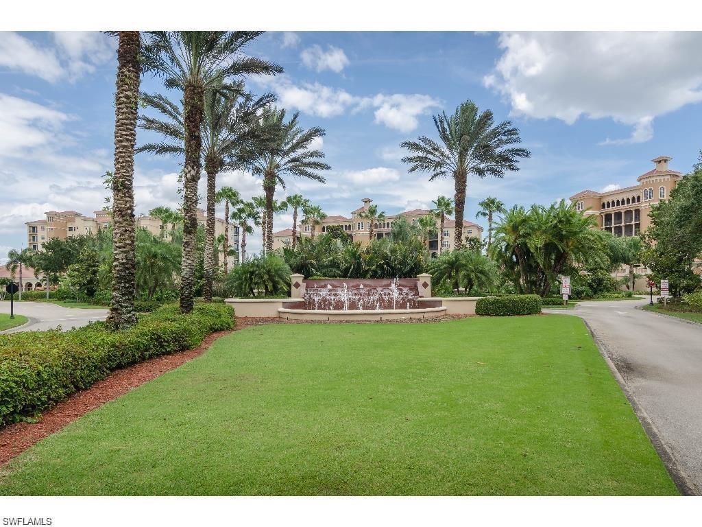 a view of a swimming pool and a yard