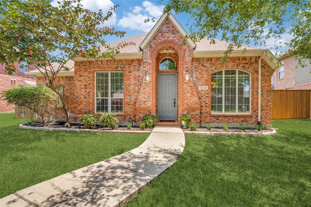 front view of a house with a garden