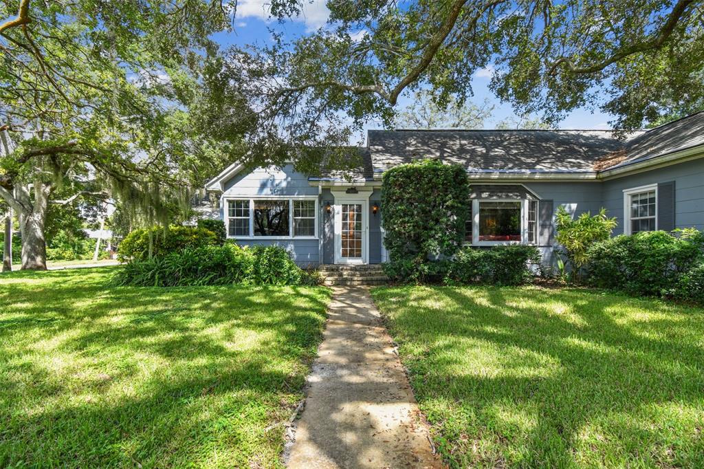 front view of a house with a small yard