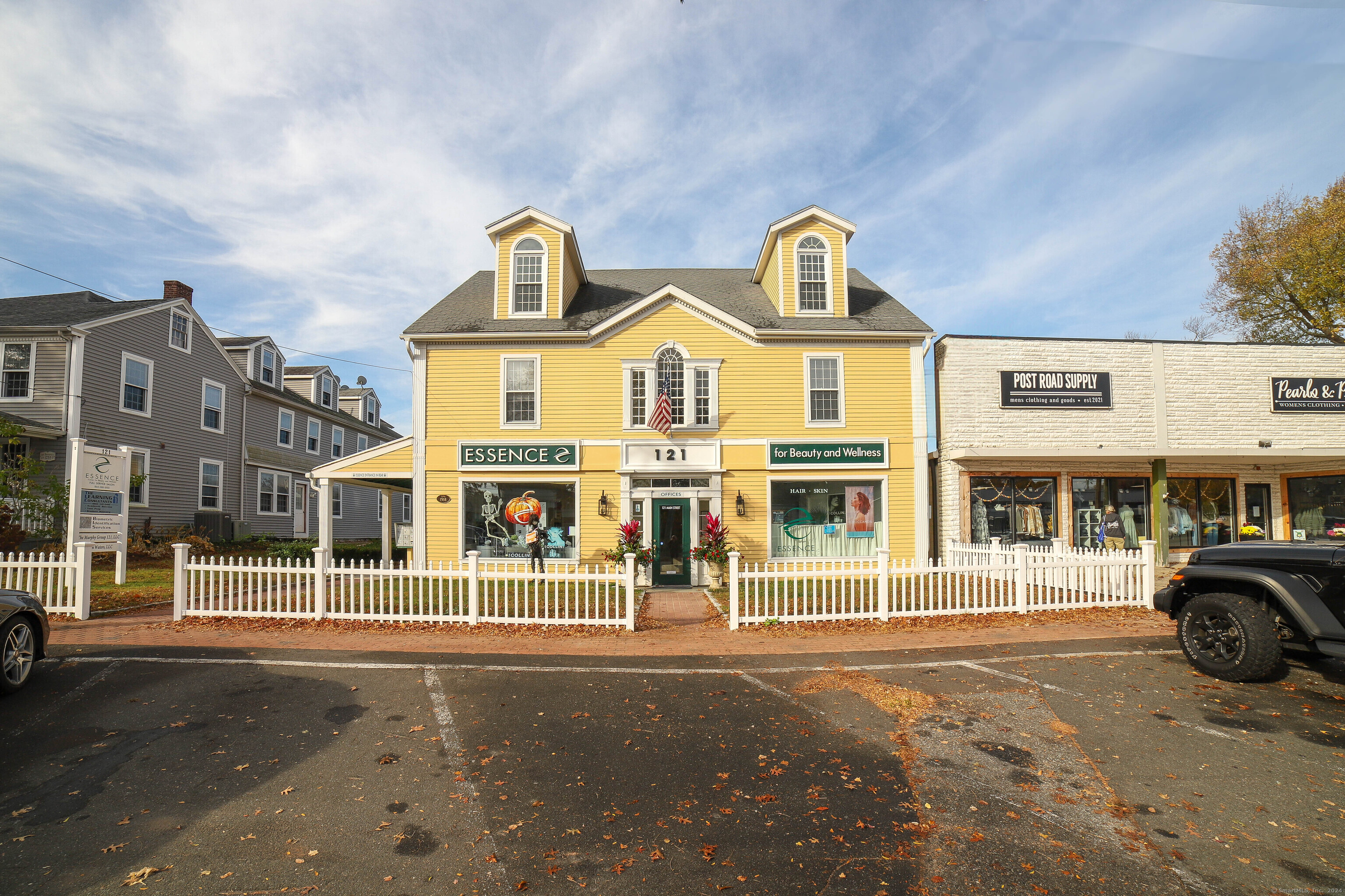 a front view of a residential apartment building with a yard