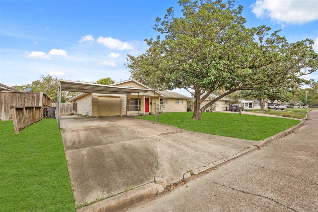 a view of house with outdoor space and tree s