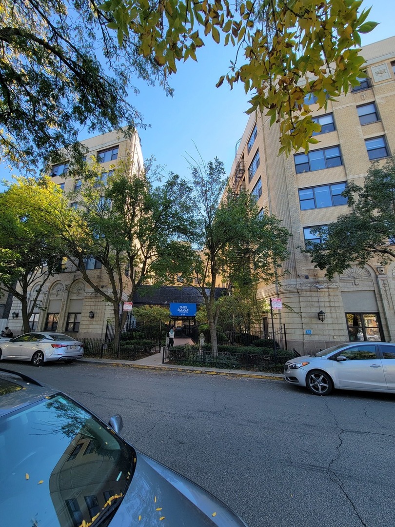 a car parked in front of brick building