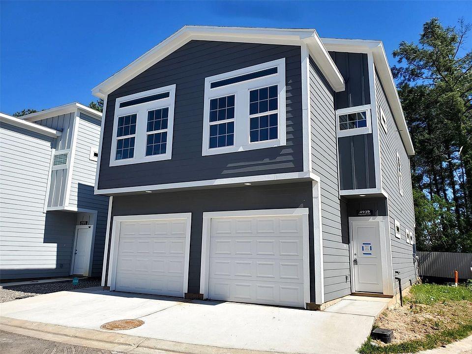 a front view of a house with a garage