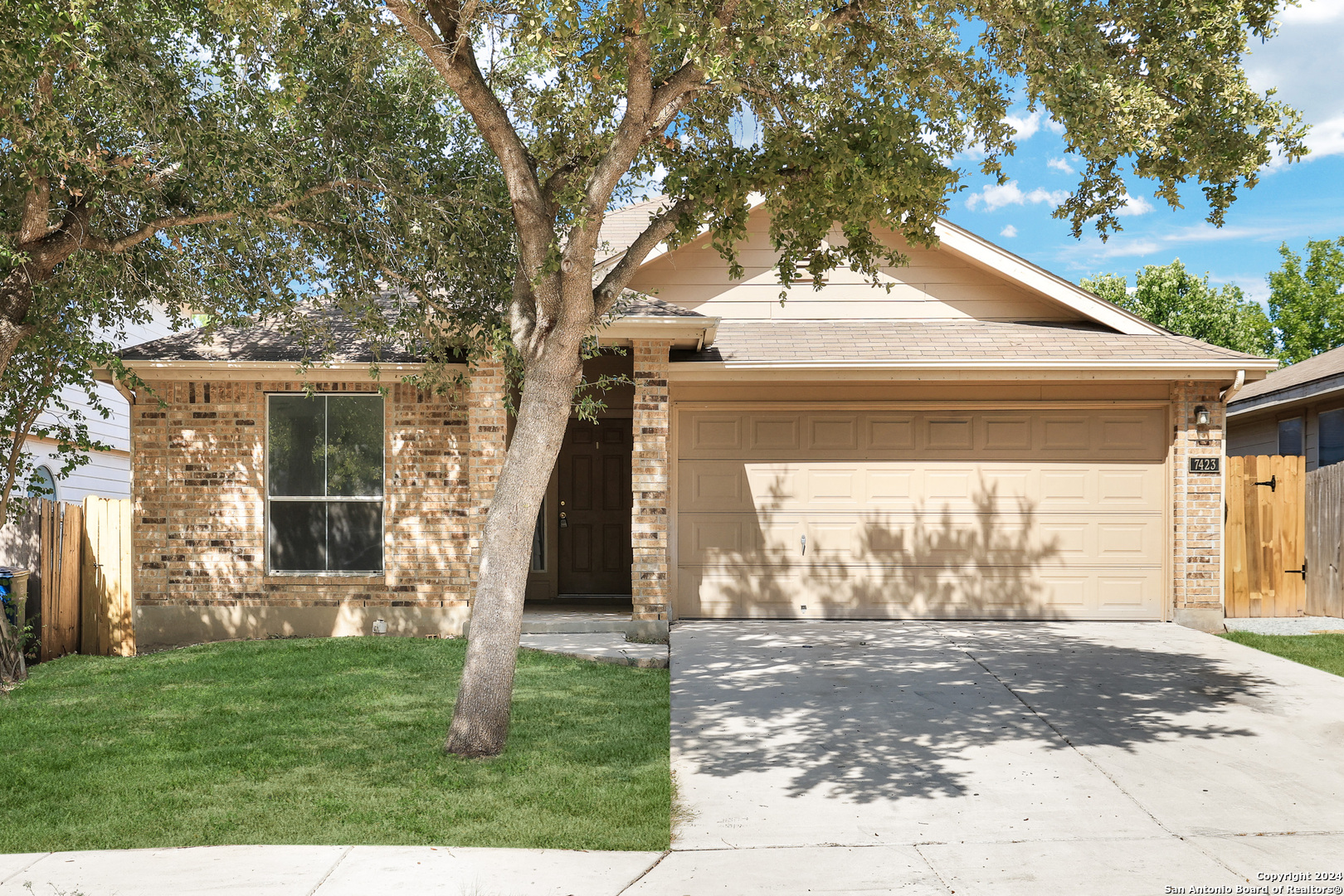 a front view of a house with a yard