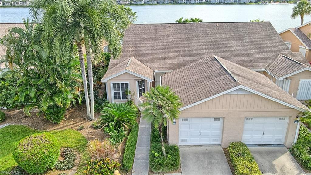 a aerial view of a house with a yard