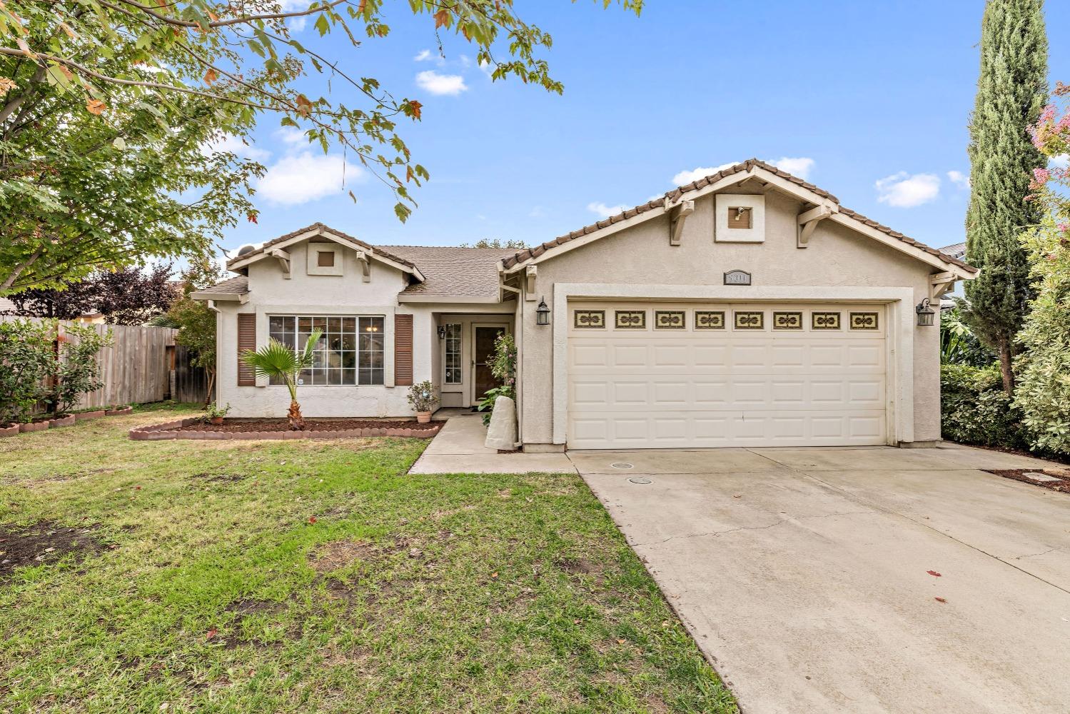 a front view of a house with yard