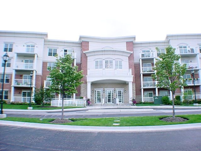 a view of a building with a yard