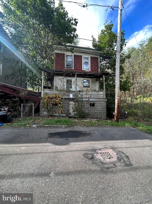 a view of a house with a yard and a garage