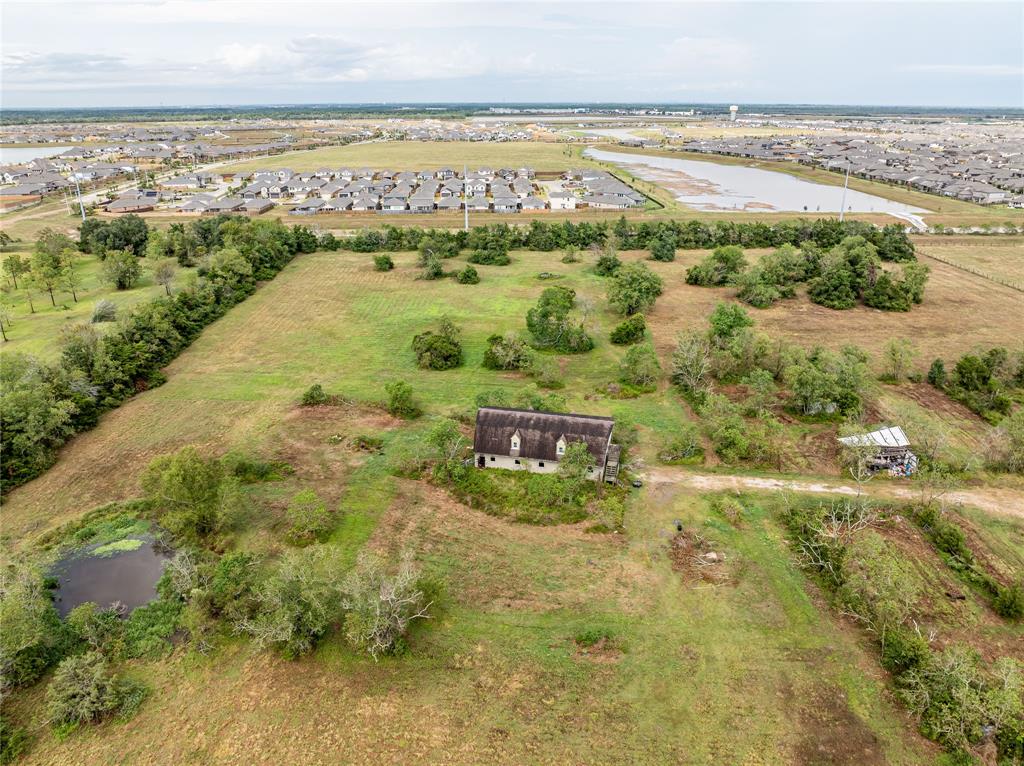 6.8 Acres with a Pond and 10 Stall Barn and Tack Room. Upstairs to be finished out with over 2000 sq ft of living space.