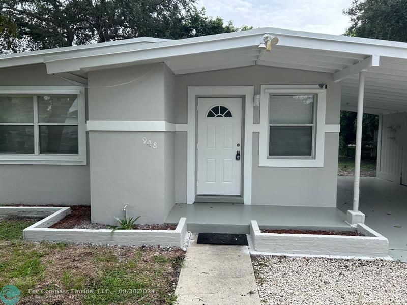 a front view of a house with garage