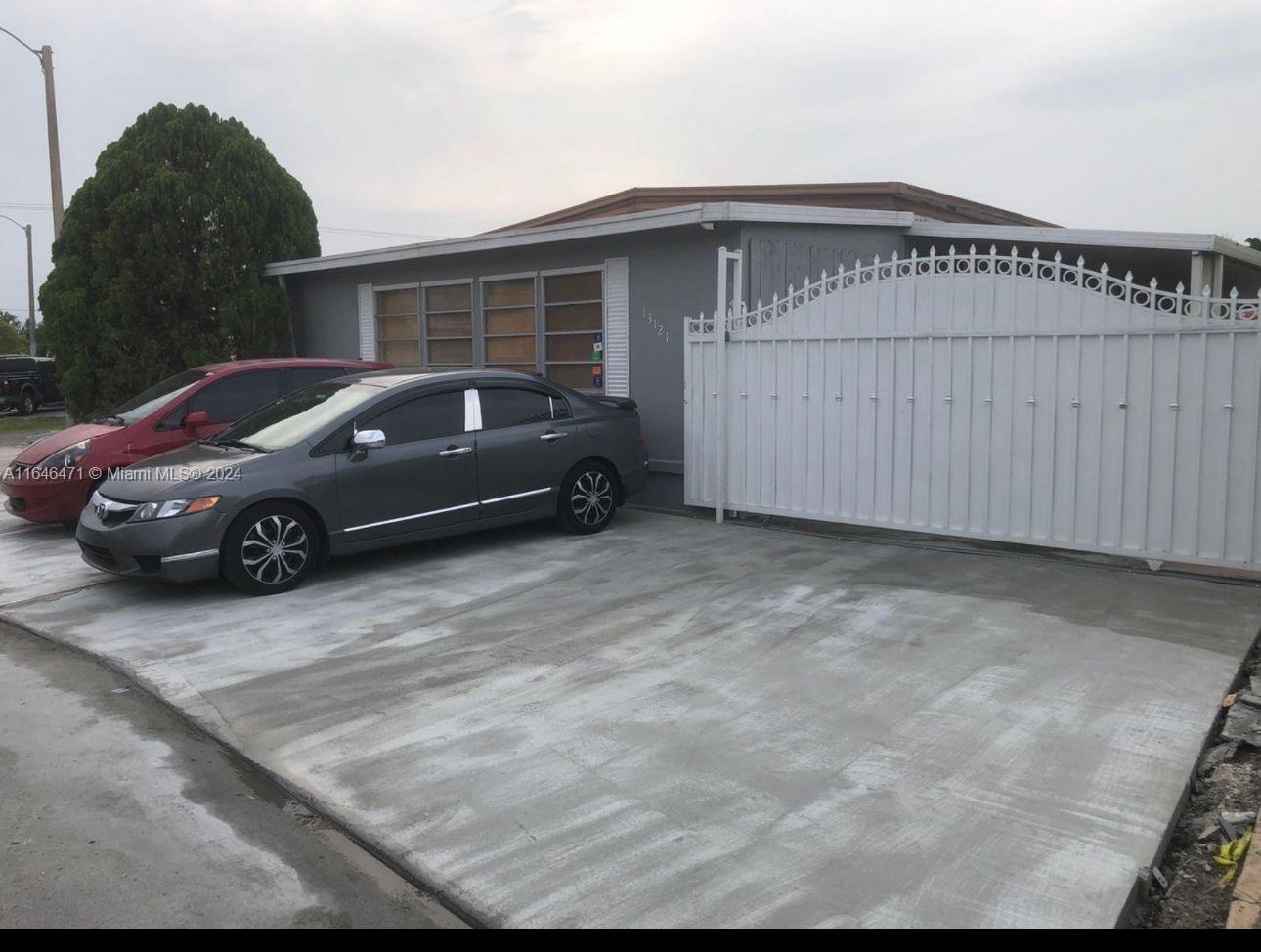 a car parked in front of a house