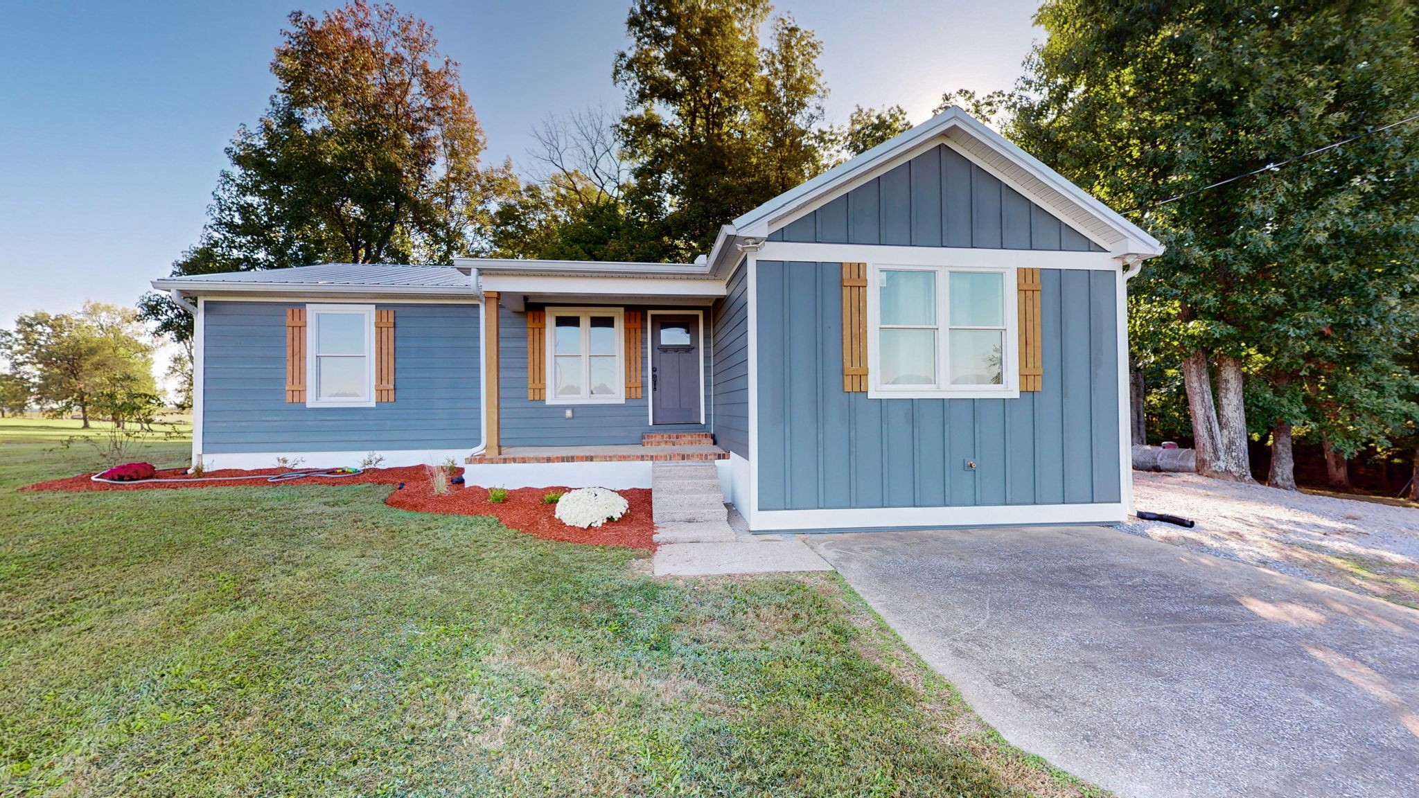 a front view of a house with yard