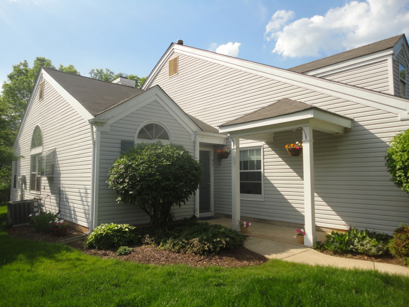 a view of a house with a yard and plants