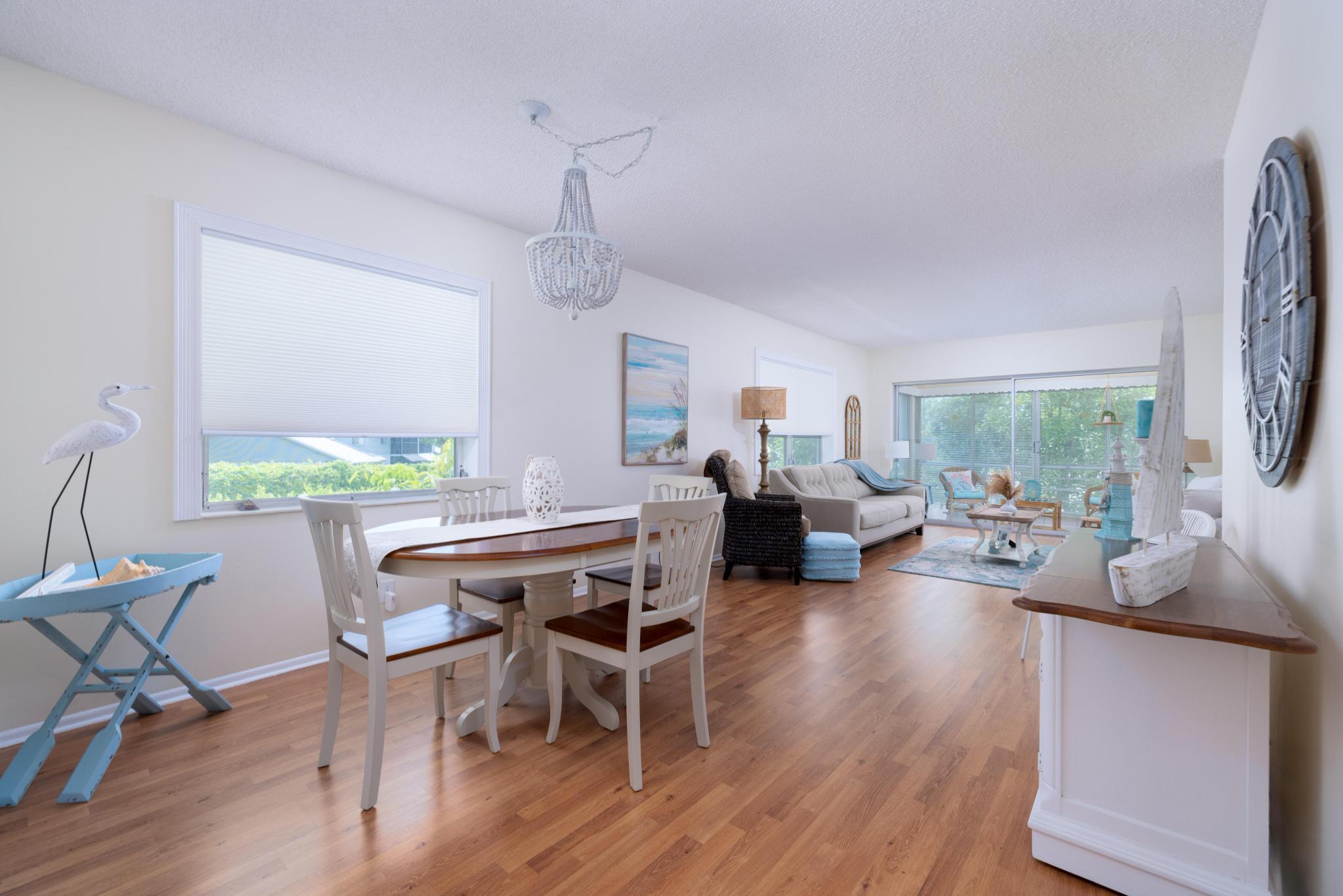 a view of a dining room with furniture window and wooden floor