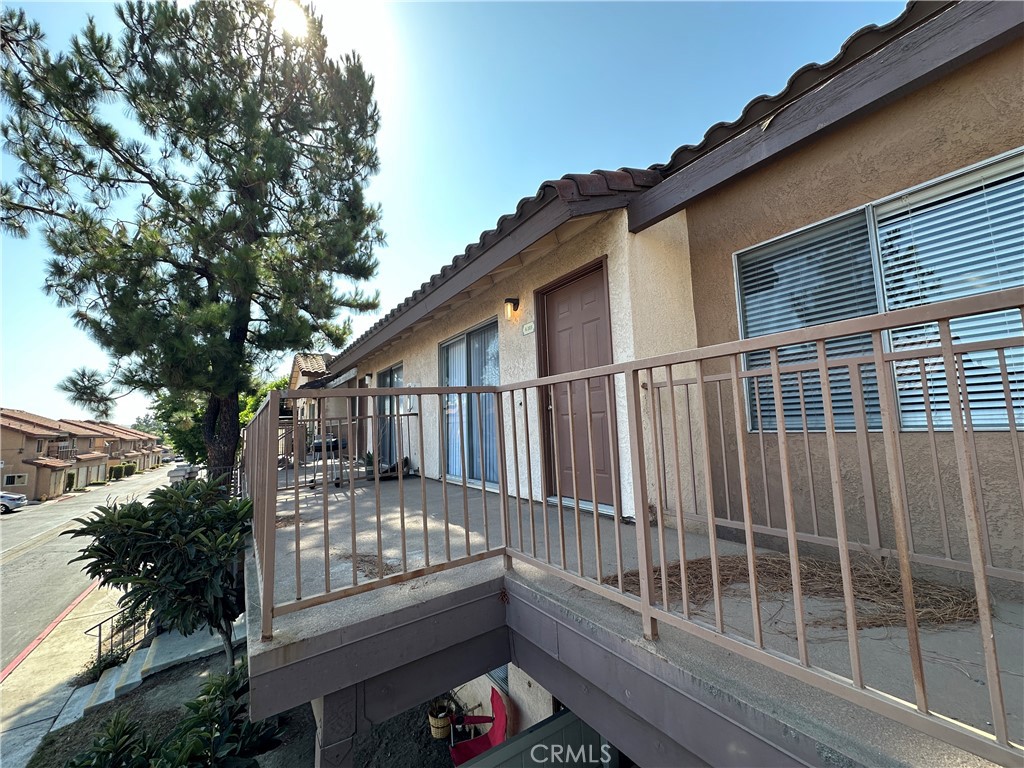 a view of a house with wooden deck