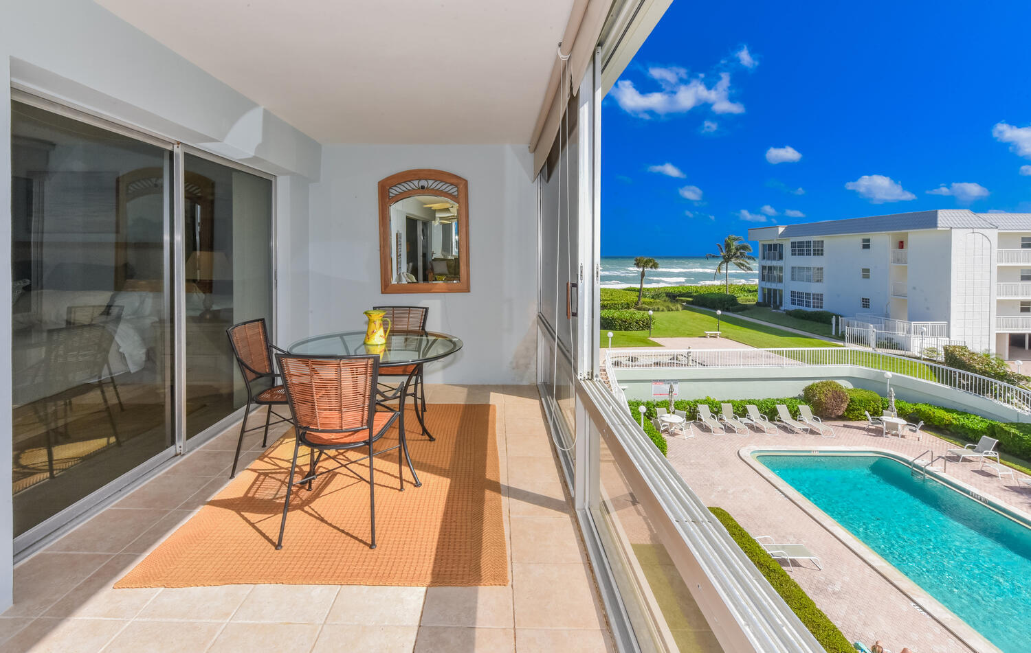 a view of swimming pool with outdoor seating