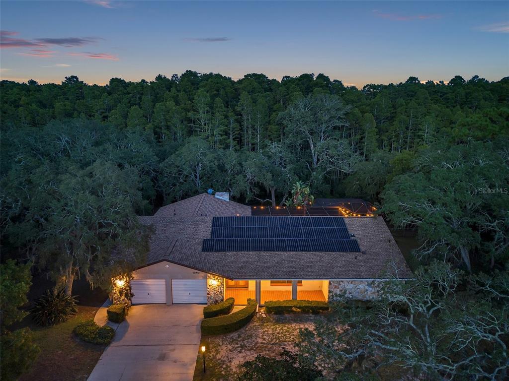 an aerial view of a house with mountain view