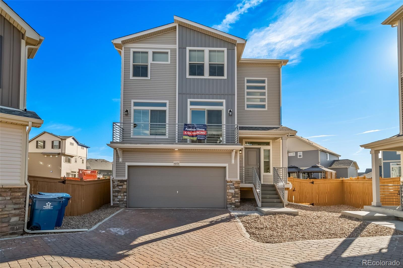 a front view of a house with garage