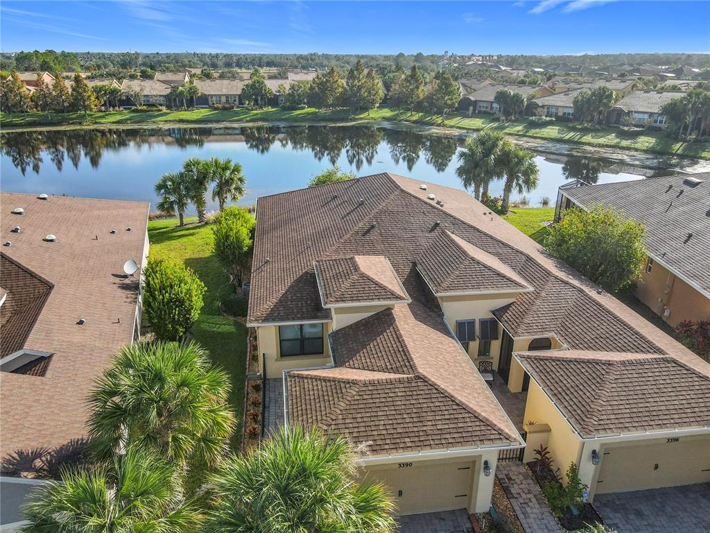 an aerial view of a house with a lake view