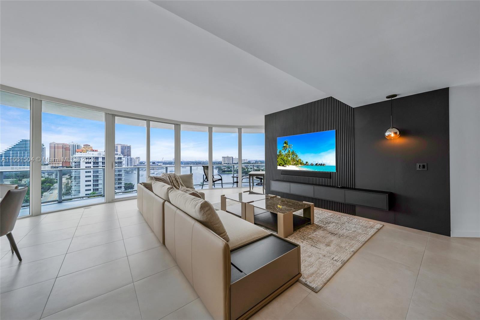 a living room with furniture and a flat screen tv