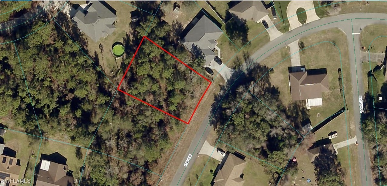 an aerial view of a residential apartment building with yard