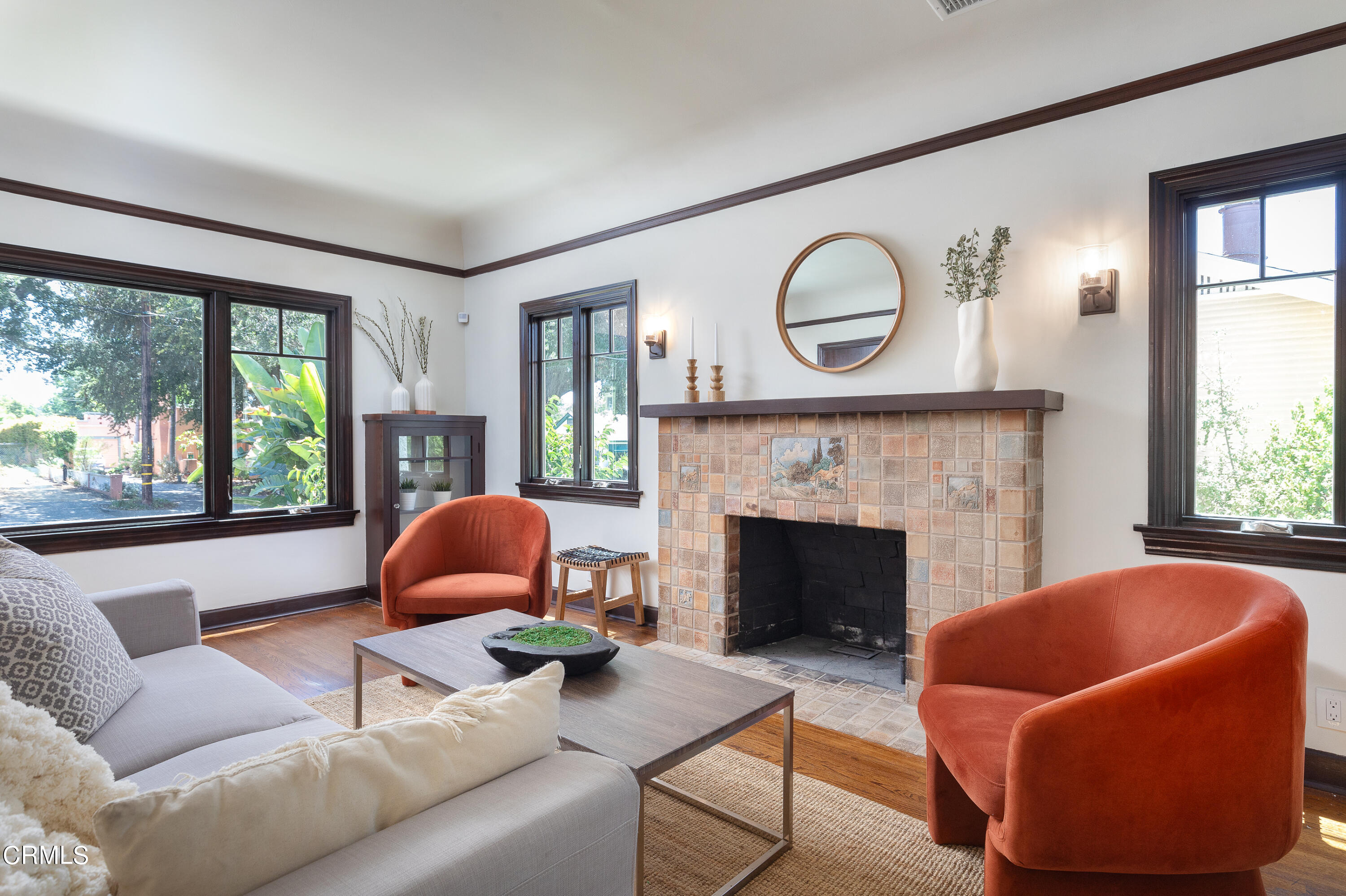 a living room with furniture and a fireplace