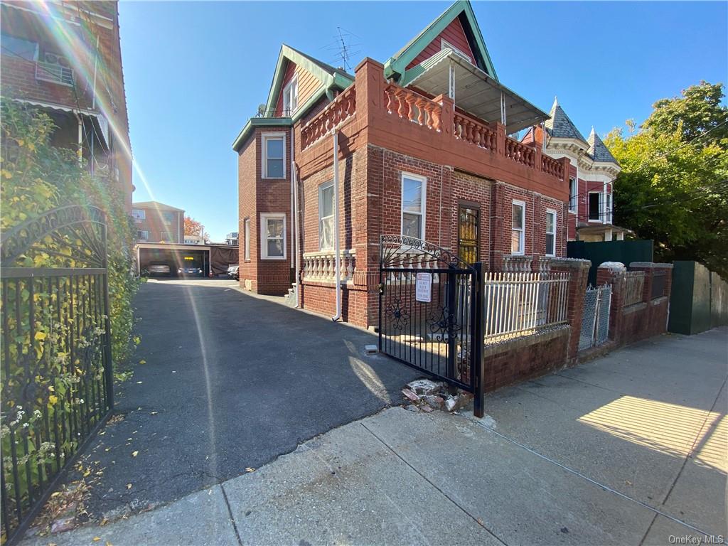 a view of a building with a yard