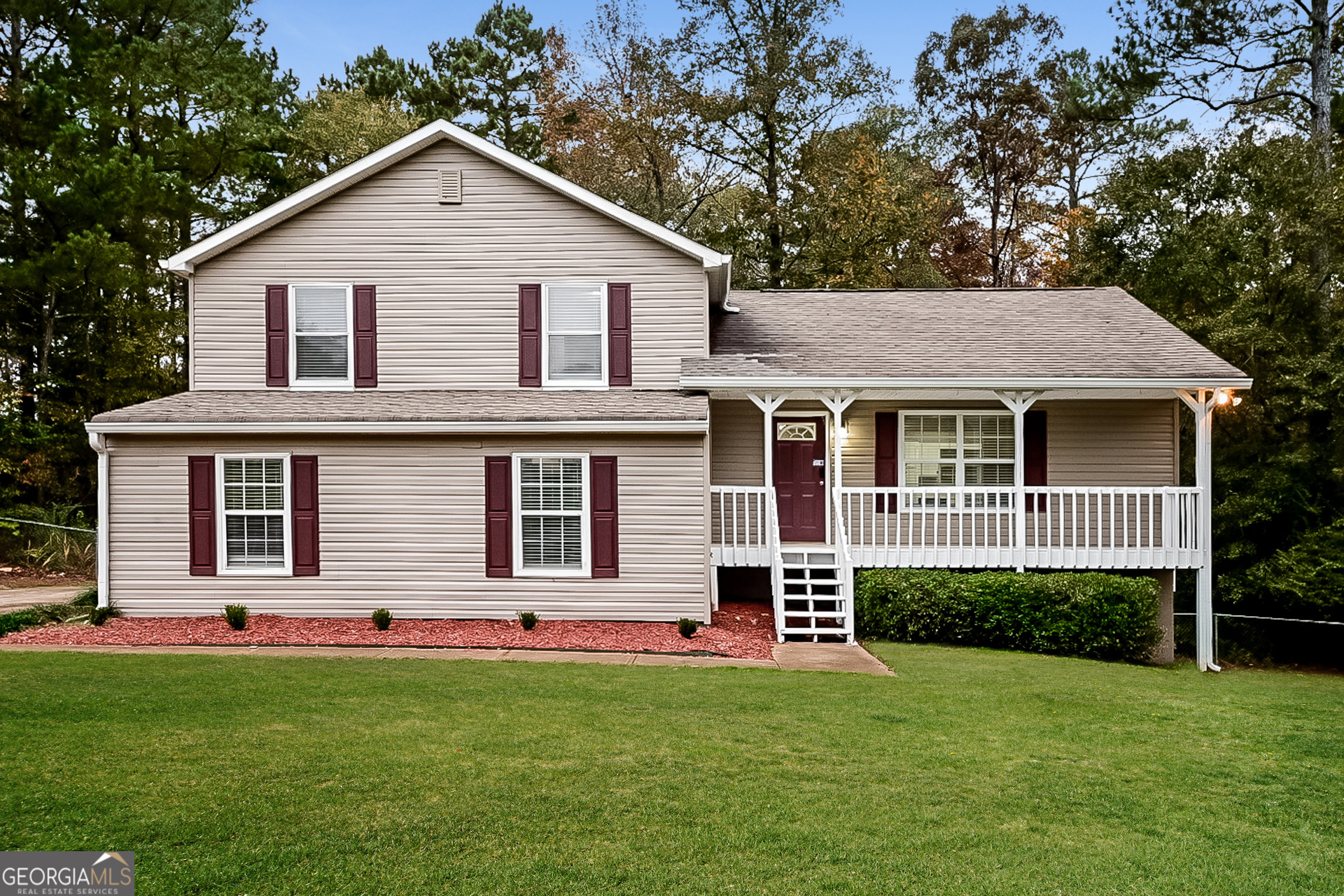 a front view of a house with a yard