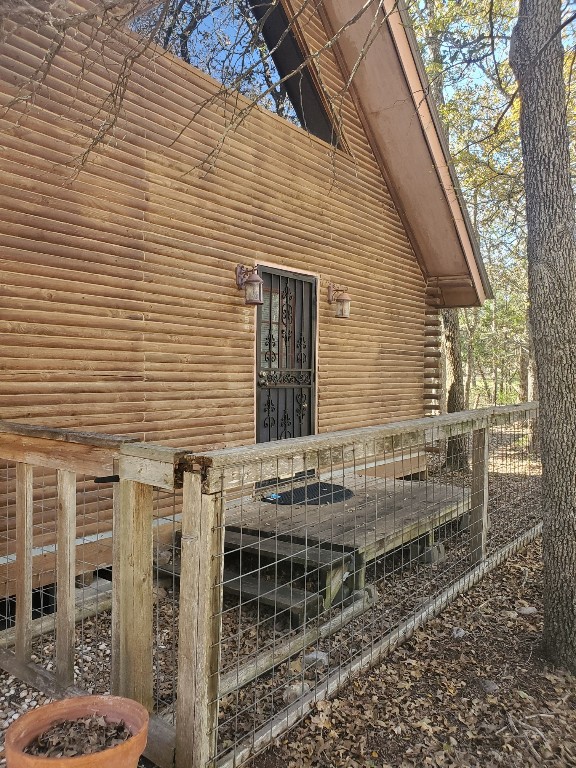 a view of house with wooden stairs