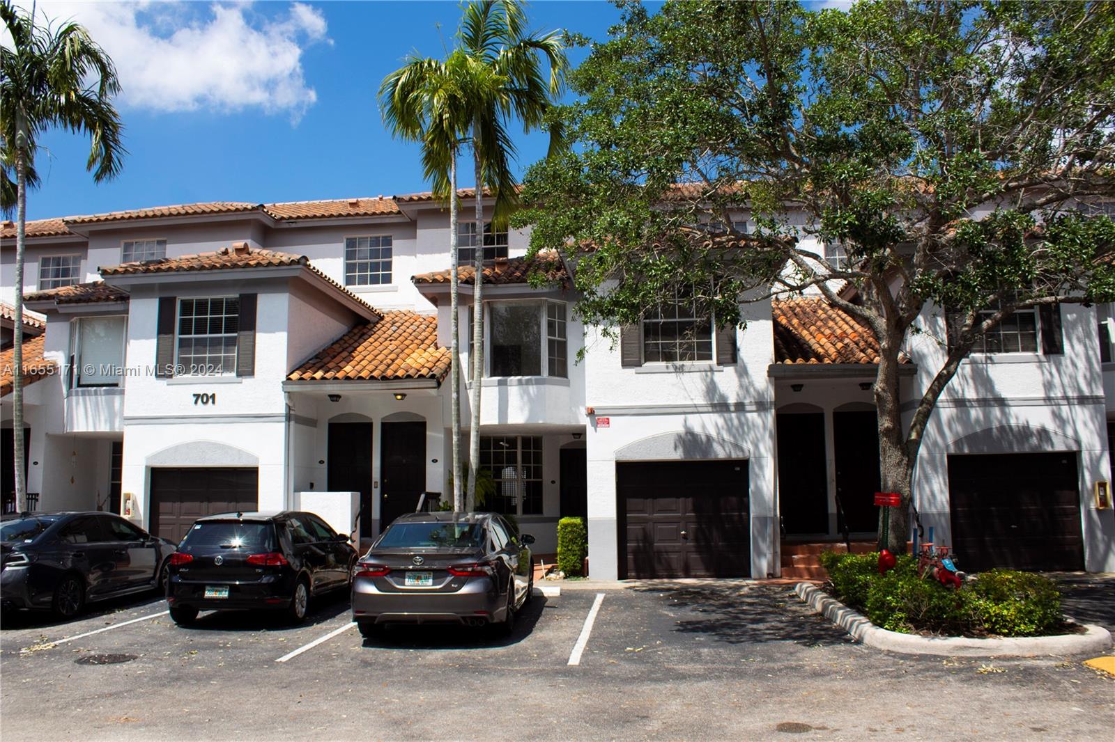 a view of a car park in front of house