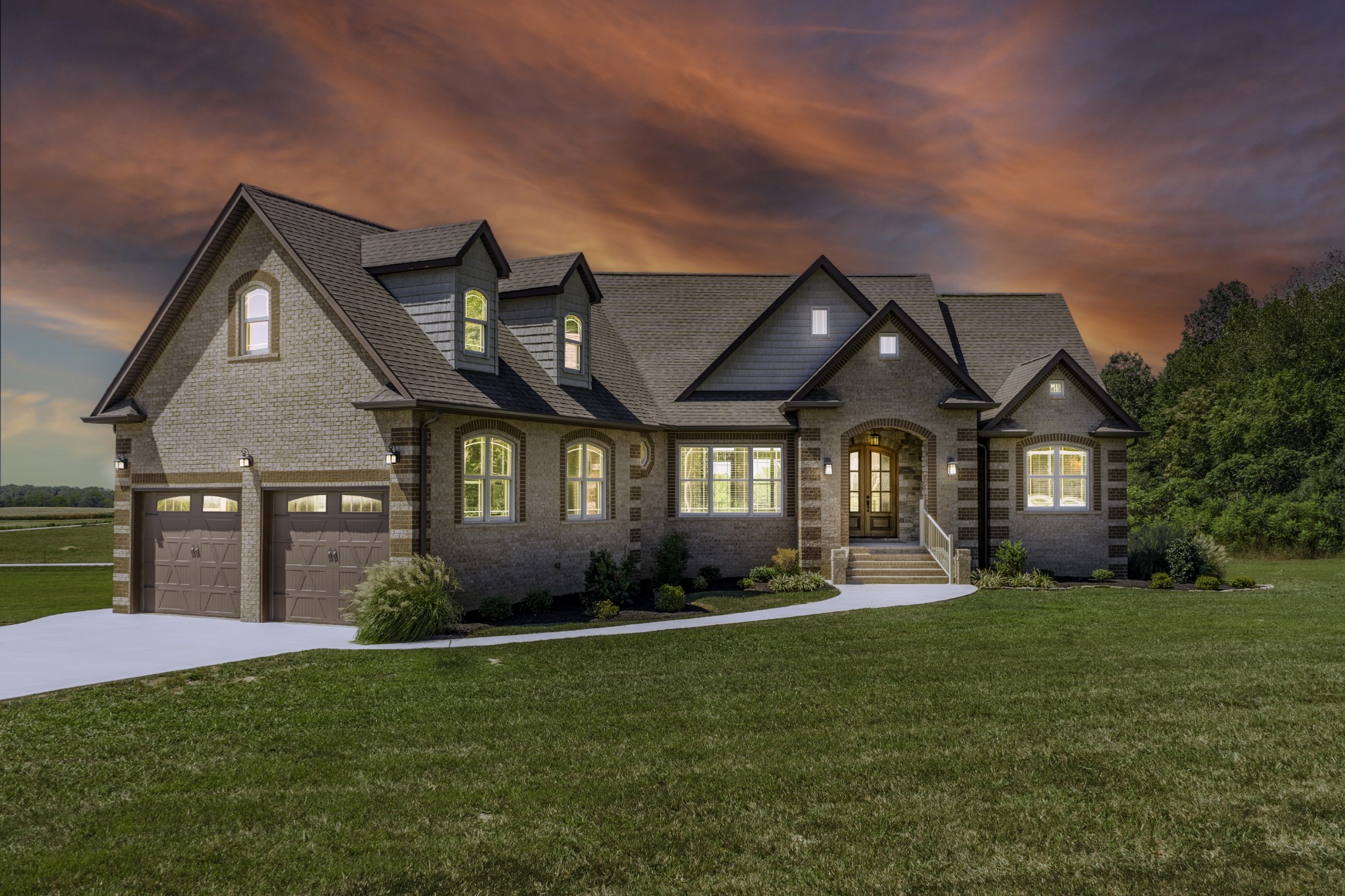 a front view of a house with a yard