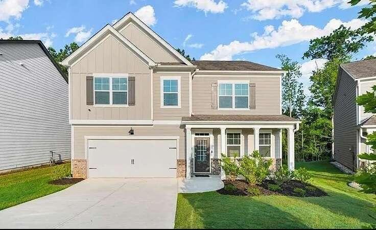 front view of a house with a yard