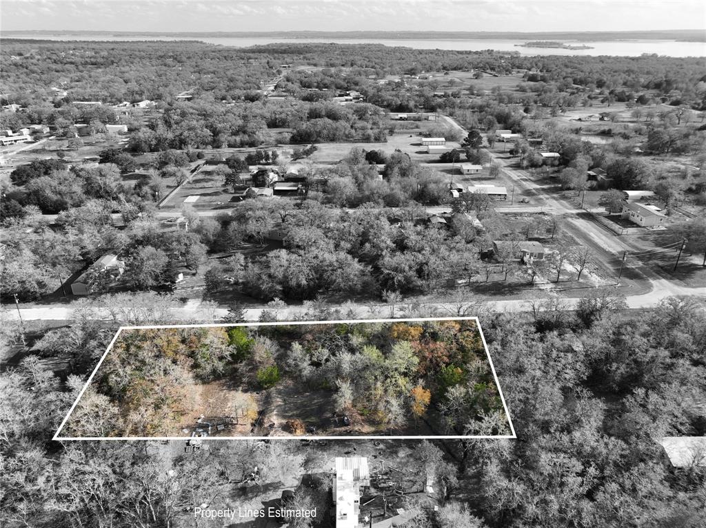 an aerial view of a residential houses with outdoor space