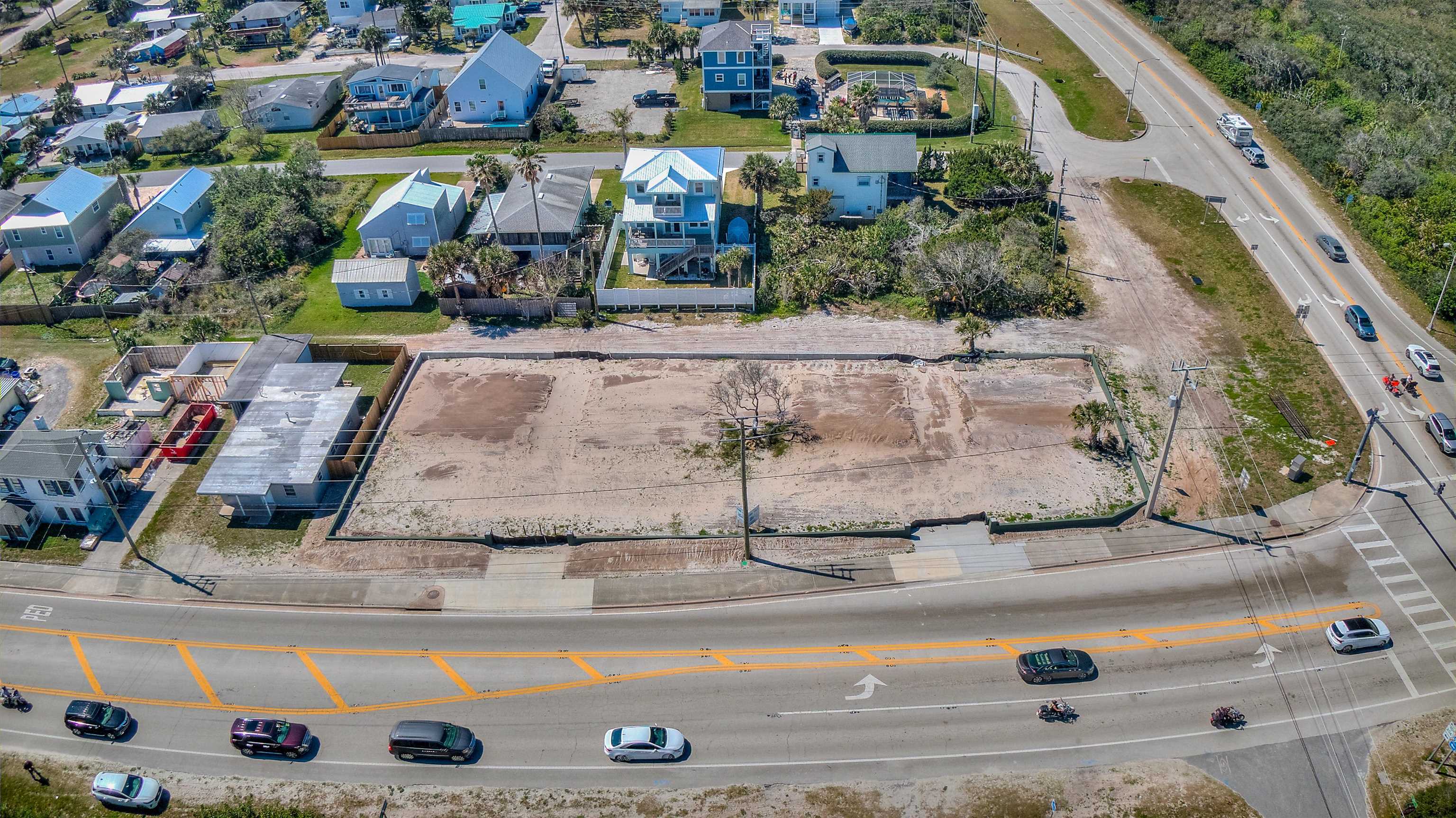 an aerial view of residential houses with outdoor space