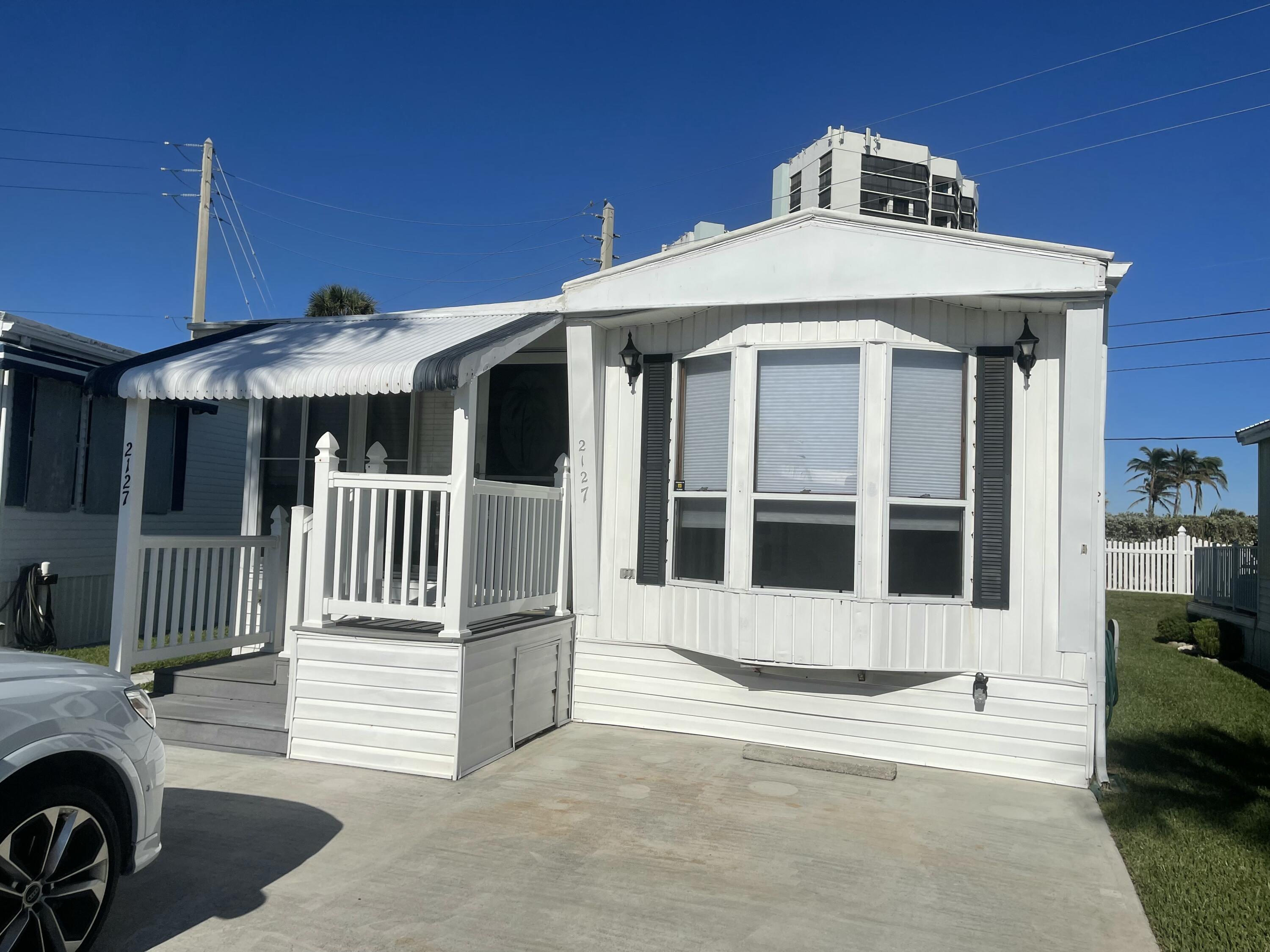 a front view of a house with a porch