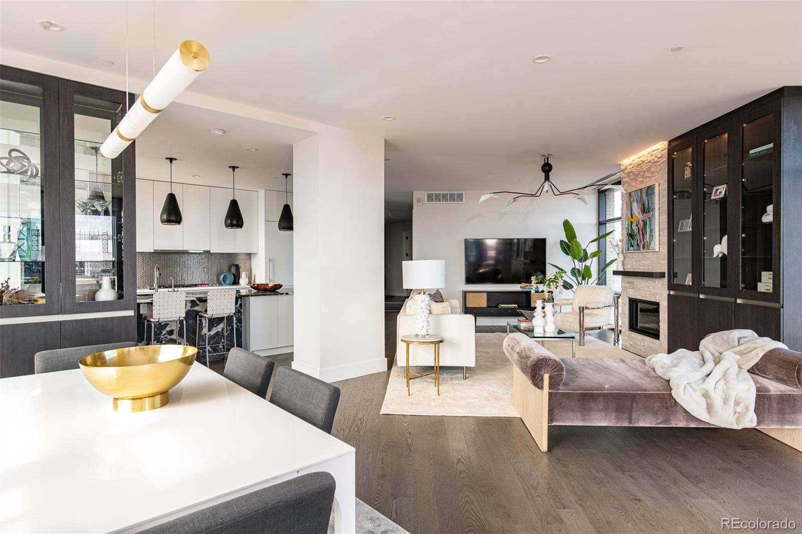 a living room with furniture and flat screen tv