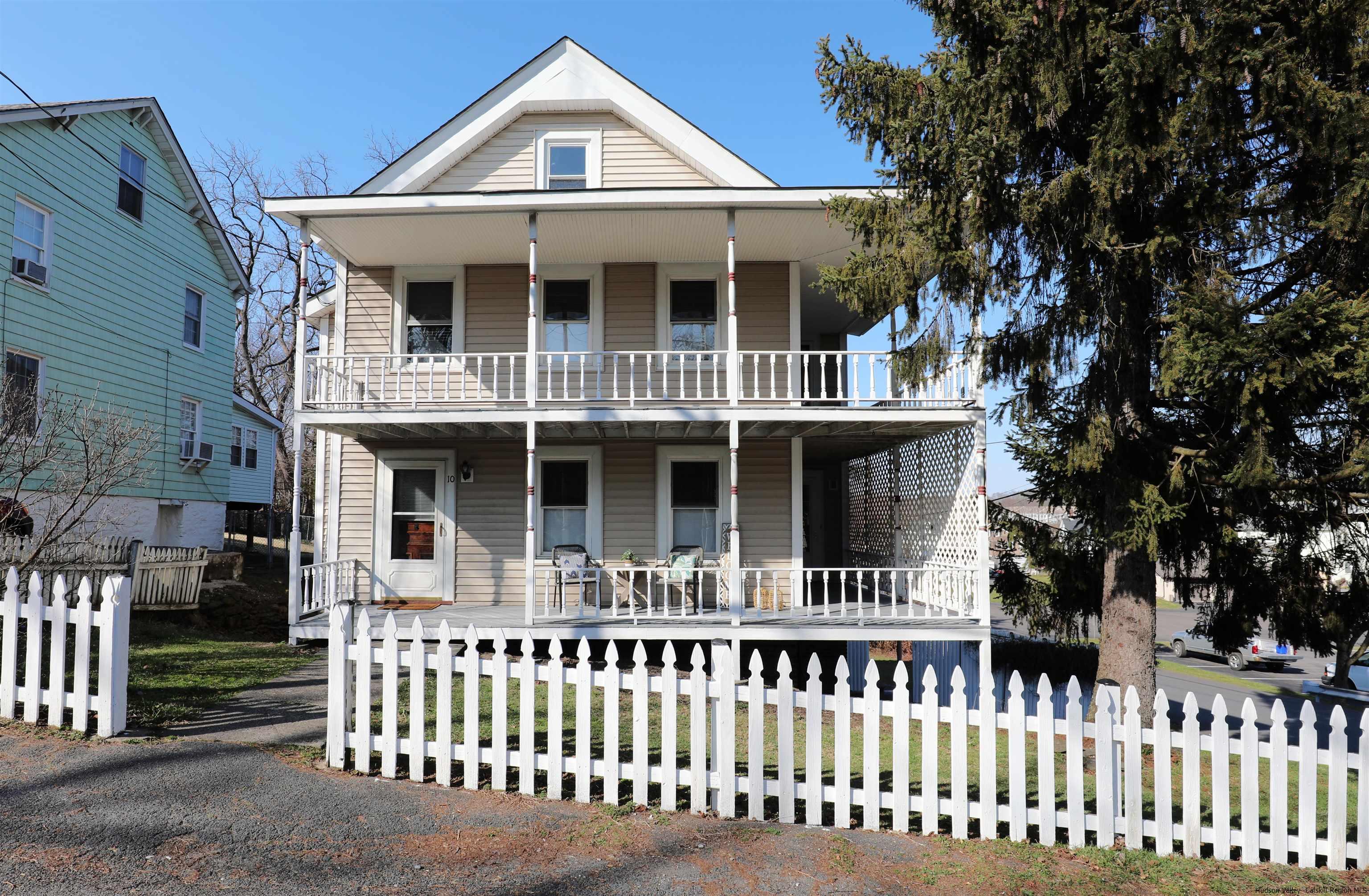 a front view of a house with a porch