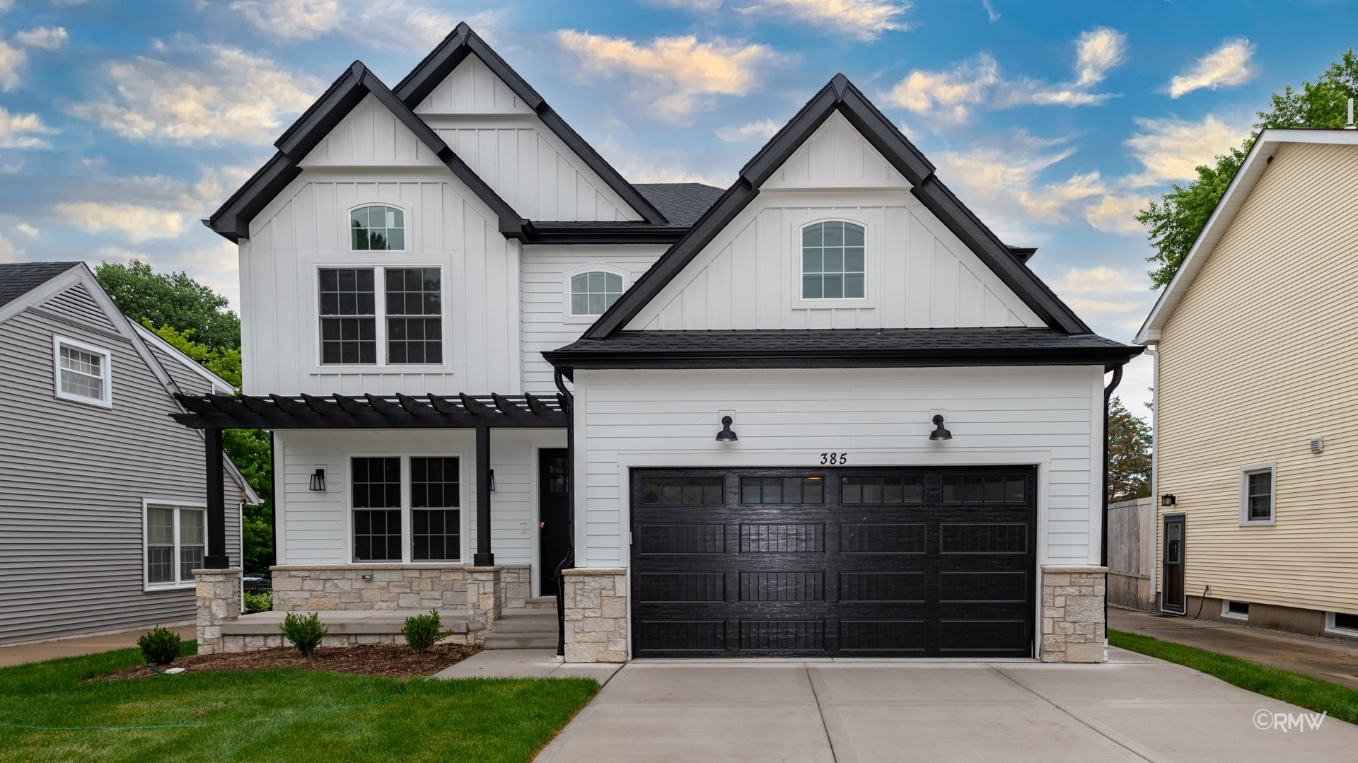 a front view of a house with a yard